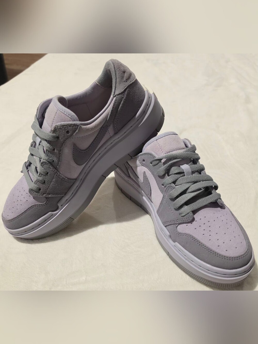 Nike Air Jordan 1 Elevate Low "Stealth/Titanium" women's platform sneakers.